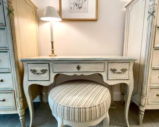 $1000 each (2 available); 33" x 19" x 54" (each tall dresser).                 $650; 41" x 20" x 29" (vanity); 21" x 17" (stool); 4-piece vintage Julia Gray French-style bedroom set painted distressed with sage green trim and brass hardware including two tall dressers (identical), a vanity (center opens to a mirror and cosmetic storage underneath) and upholstered stool