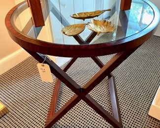 $1000; 30"d x 29"h; Polo Ralph Lauren mahogany round, glass-top side table with "X" wooden base (similar new at Bloomingdales for $4000)                                                                                $18 each (three available); small, golden leaf dishes