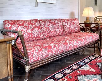 $1400; 85" x 30" x 33"h (couch);  McGuire target-back bamboo rattan sofa with two sets of custom cushions (second set in chocolate base color and botanical print)