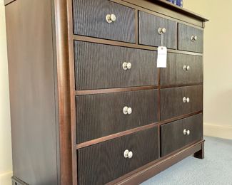 $650; 60" x 20" x 44"; Nautica Home by Lexington 9-drawer dresser with front vertical ridges and chrome hardware; two matching side tables sold seperately