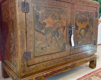 $3500; 43" x 22" x 35"; carved and painted Chinoiserie two-door cabinet with latch and key by Trouvailles, Inc. with lacquered red interior--stunning    