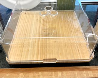 $80; bamboo cheese board by Alessi with covered acrylic lid