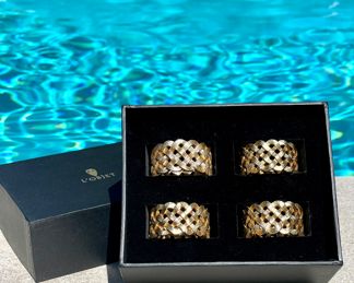 $100 each set (7 sets available); set of 4 L'Objet braided gold napkin rings (sells new for $190)