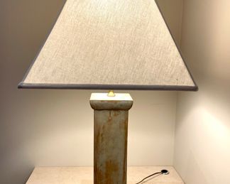 $250; 16" x 16" x 32"h; table lamp with colunmar base in weathered cast stone