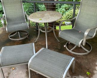Two Swivel Patio Chairs with Ottamans and Table