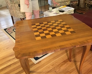 You need this adorable game table!  It is an unusual split table with Checkerboard design ...what a conversation piece, even is you just use it for cocktail parties!