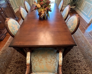 109. Invincible Fine Furniture Carved Dining Table w/ 2-24" leaves (48" x 96") and a set of 8 Chairs - 2 Arm (24" x 24" x 41") 6 Side (24" x 24" x 41") w/ 2-24" leaves