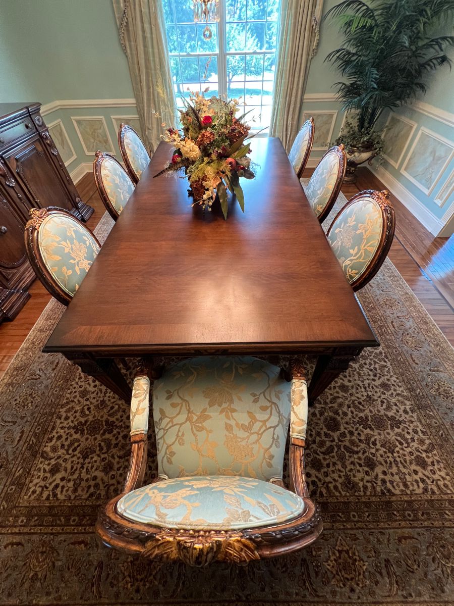 109. Invincible Fine Furniture Carved Dining Table w/ 2-24" leaves (48" x 96") and a set of 8 Chairs - 2 Arm (24" x 24" x 41") 6 Side (24" x 24" x 41") w/ 2-24" leaves