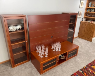 Danish cherry entertainment by Jesper. Purchased from Techline Studios. Also in photos are two stunning sets of french Baccarat crystal stemware in the "D'Assas" pattern