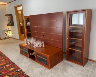 Danish cherry entertainment by Jesper. Purchased from Techline Studios. Also in photos are two stunning sets of french Baccarat crystal stemware in the "D'Assas" pattern