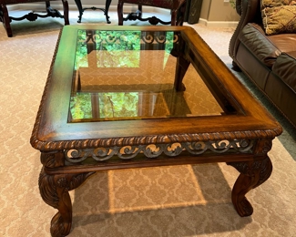 $150
OUTLOOK INTERNATIONAL, LTD WOOD AND GLASS COFFEE TABLE 
50”L x 36.5”W x 20.5”H 