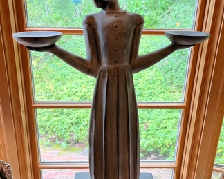 Dining Room:  A 28" tall  statue titled "Bird Girl" stands between the two display tables.