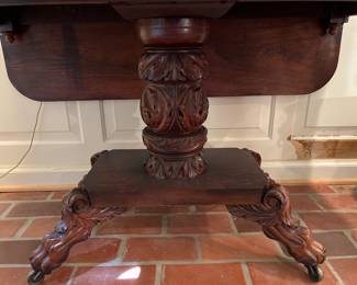 Dining Room:  This is the table base of the drop-leaf table previously shown.  Notice the heavy carving on the column and the hairy paw legs. (It is on casters.)