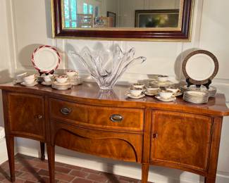 Dining Room:  A vintage HENREDON sideboard (72" x 23" x 37" tall) with banding has one center drawer and two side doors.  The china on the left is LENOX "Bellevue" (see next photo).    The china on the right side is the same Lenox "Barclay" china that is displayed on the dining room table.  This set includes 8 dinner plates; 9 salad plates; 8 bread & butter plates; 6 coffee cups; and six saucers.  The vintage wall mirror is also for sale. 