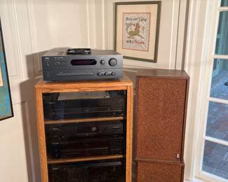 Dining Room:  A media cabinet displays several pieces of electronic equipment:  NAD stereo receiver; Sony 5- disc player; Philips CD recorder; Kenwood CD player; and a Sony CD player. To the right is a pair of FISCHER XP-56 stereo speakers.  The SCHATZ Royal Mariner wall clock and sign are also for sale. More electronics are in the lower level.