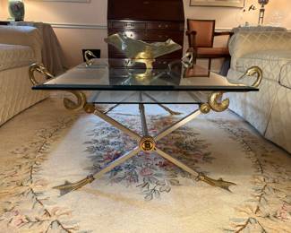 Living Room:  This unusual brass swan and silver base table is gorgeous!  Notice the four swan bodies embracing the upper glass, and the lower webbed feet supporting the table.  It also has a smaller glass shelf under the table top.  Its total measurement from the back of the swans' heads to the table edge is 42" x 30."
