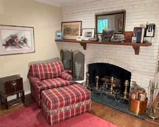 Family Room:  A reproduction of an antique desk on a stand is to the left of a  "Redwood Plaid" occasional chair with matching ottoman.  Also shown is an eclectic group of artwork, books, duck decoys, and more.