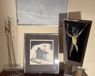 Family Room:  Two metal sculptures by the artist "James Garner" flank two pieces of art by the artist Ward H. Nichols.