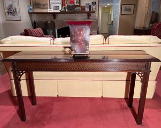 Family Room:   A 54" long Chippendale-style sofa table includes heavy carving on the apron. The metal tole planter is also for sale.