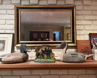 Family Room:  Two vintage wooden duck decoys carved out of juniper wood are from Harkers Island in the outer banks of North Carolina.  The antique cast iron door stop is a horse drawn coach.