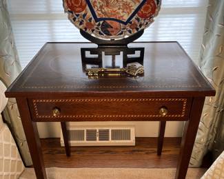 Living Room:  This antique one-drawer table has beautiful banding around the table top and drawer (the top also has a string banded oval).  The antique IMARI bowl rests on a decorative wooden stand.