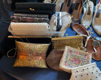Evening purses.  Gold purse in front on left is metal w/ copper bands
