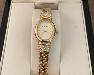 Closeup view of Elgin woman's stainless steel gold watch,  $20