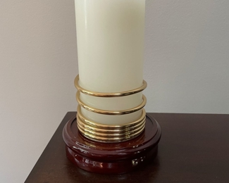 Candle with gold decorative rings, $8