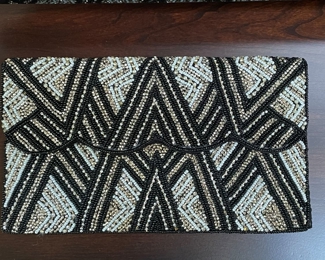 Black, silver & white beaded clutch,  $20