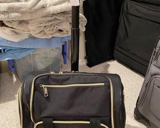 Bebe black & gold carry on luggage w/handle, $34