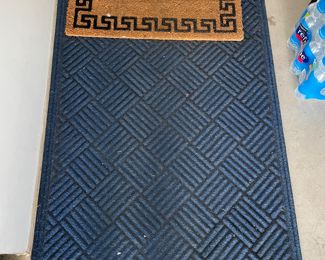 Blue outdoor rug,  $20.  Brown rug,  $8