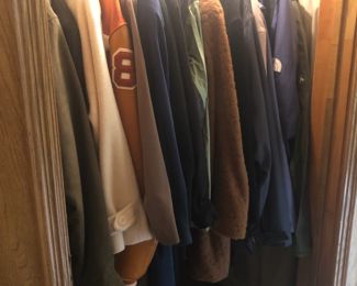 Coat closet with fur, North Face, and REI