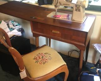 Singer sewing machine in cabinet