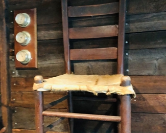 Many hand made hide bottom chairs