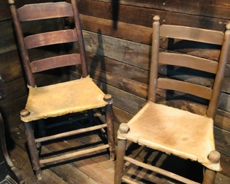 Three  hand made hide bottom Pierce chairs