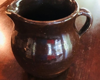 Small brown pottery pitcher