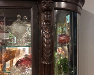 Antique bow front claw foot china cabinet with carved lion heads 