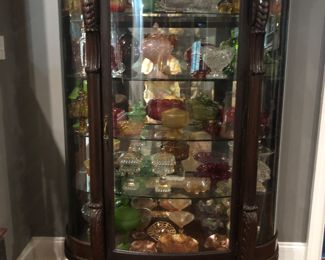 Antique bow front claw foot china cabinet with carved lion heads 