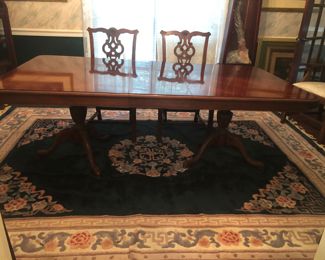 Duncan Phyfe cherry dining table with Chippendale chairs with new upholstered seats