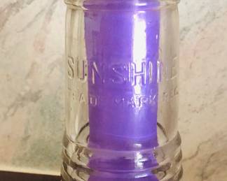 VTG SLOPE SIDE EMBOSSED SUNSHINE HALF PINT ORANGE SODA POP BOTTLE
There are 24 bottles in a wooden crate  with sunshine  on the crate.  Atlanta Ga company. Some of the bottle have Atlanta on the bottom 