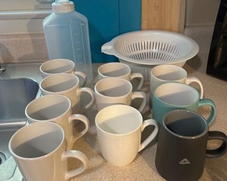 #50 Cutting boards, strainer & mugs (all pictured) $10