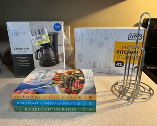 #52 New 42 pc. kitchen utensil set, new coffee maker, 3 cookbooks and paper towel holder (all pictured) $50
