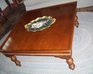 5'8" X 8'7" BRAIDED RUG AND LARGE SQUARE COCKTAIL TABLE IN FAMILY ROOM .  8'1" X 11' BRAIDED RUG IN DINING ROOM