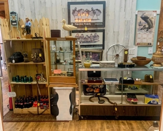Display cases - Floor & Tabletop.  Bookshelf.  Vintage Razors, Coke Bottles, Pictures, Harley backrest, insulators, Cast Iron Room Warmer, Boat Steering Wheel