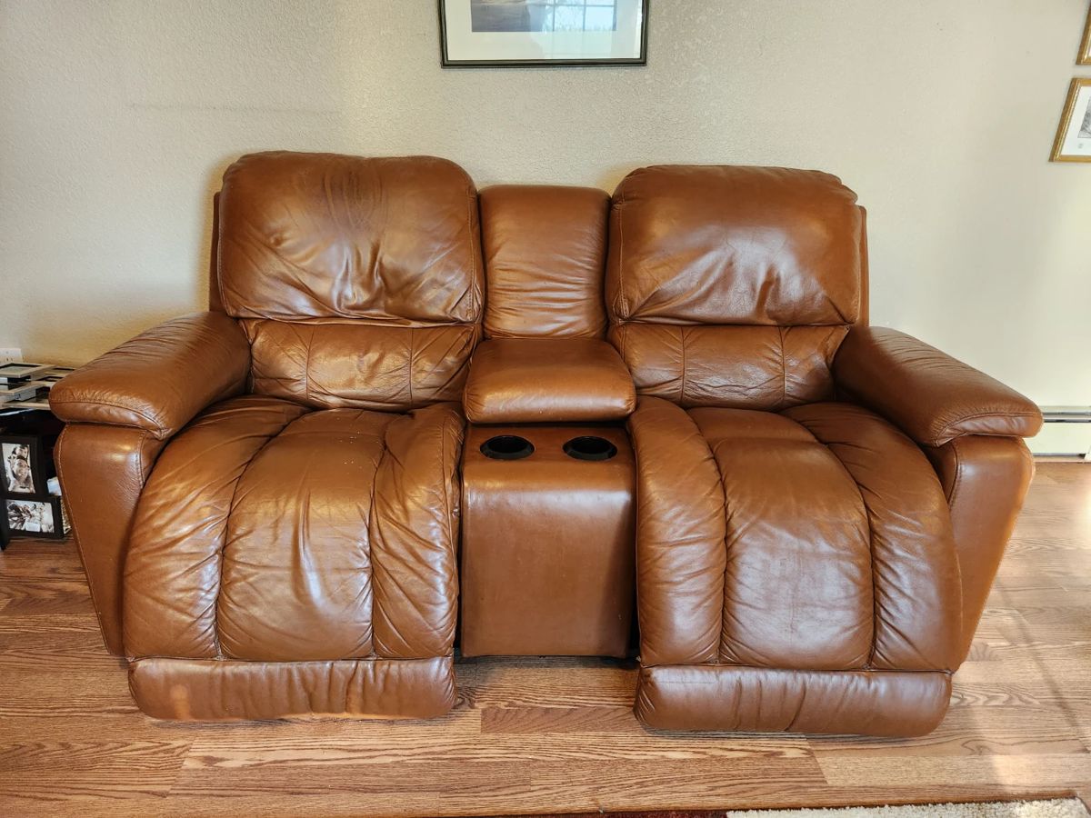 Reclining loveseat with console