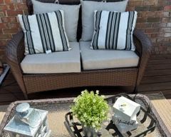 Outdoor loveseat with cushions 