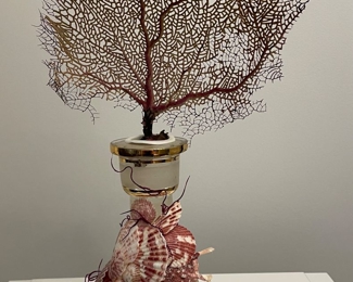 $150 Vintage carafe with rings of gilt and floral etching, encrusted with shells.  An 8” width and depth dimensions take into account the space needed for the coral fan, whereas the bottom carafe diameter is 4”