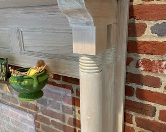 Mantle stands balanced against a wall - we have always used it as a shelf 