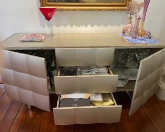 Tap to open 3 drawers and 2 cabinets with a mid-way glass shelf provide loads of storage. 