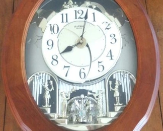 Small World Woodgrain Stars Musical Wall Clock 
By Rhythm USA